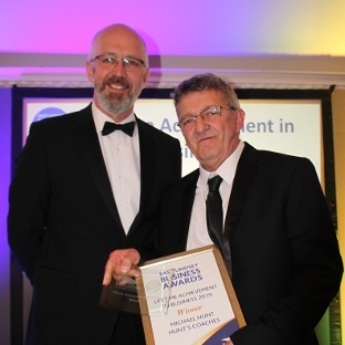 Michael Hunt collecting his Lifetime Achievement in Business Award - presented by East Lindsey District Council Leader, Councillor Craig Leyland