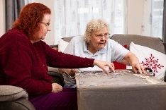 Older ladies doing puzzle