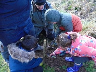 Children from Binbrook Primary School planting their communty orchard