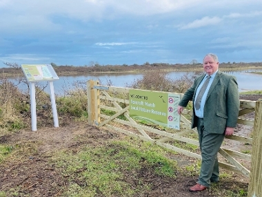 Cllr Graham Marsh at one of the new gates and interpretation boards at Seacroft Marsh