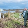 Cllr Graham Marsh at one of the new gates and interpretation boards at Seacroft Marsh